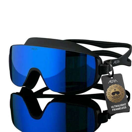 ÆRA Blue Steel swimming goggles in blue and black with AERA branding, featuring anti-fog lenses and UV protection for adults.
